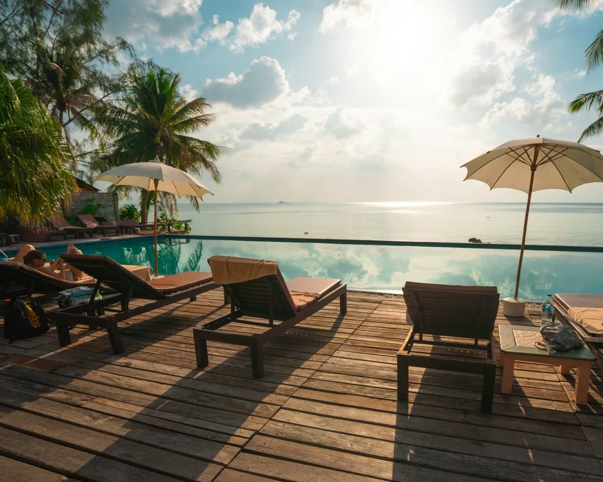 Poolside deck facing the sea at sunset